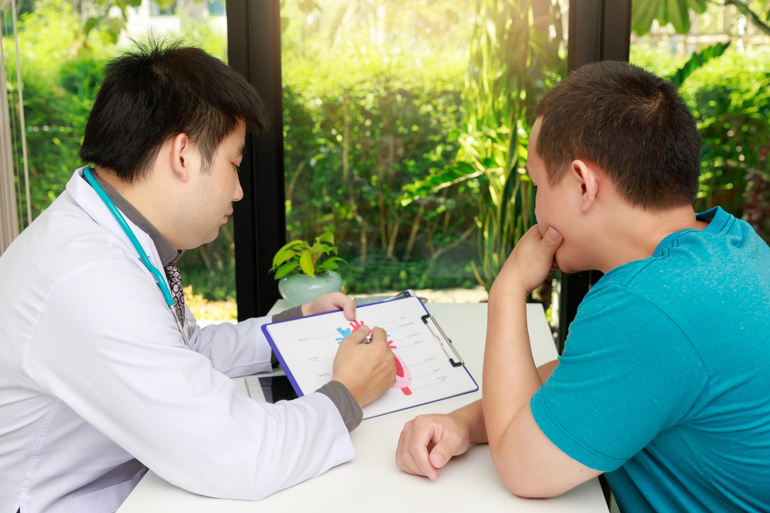 father-with-son-sitting-table how does cbt therapy work